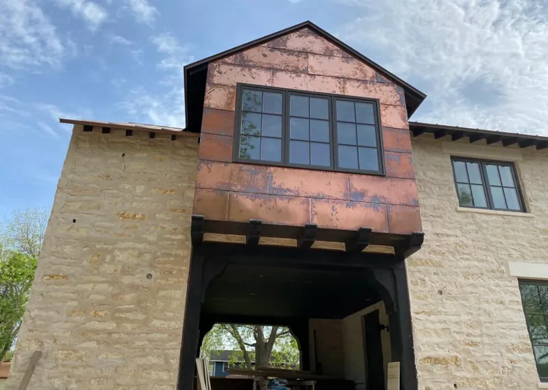 Copper metal panel facade on a stone building for Metal Roof Coating in North Sewickley